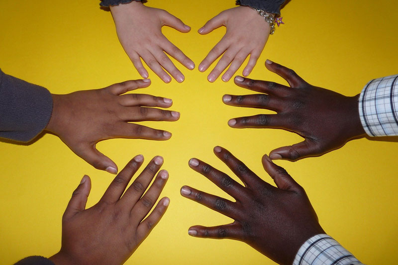 Photo of childrens hands arranged in a circle
