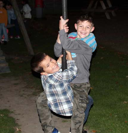 Two school boys having fun on a zipwire